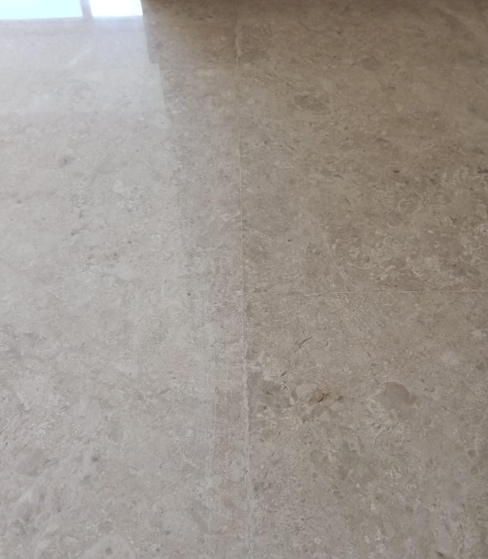 Dull, worn marble floor surface before polishing