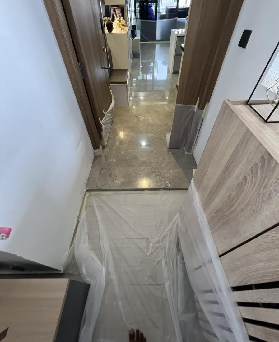 Protective sheeting laid in a corridor before marble work